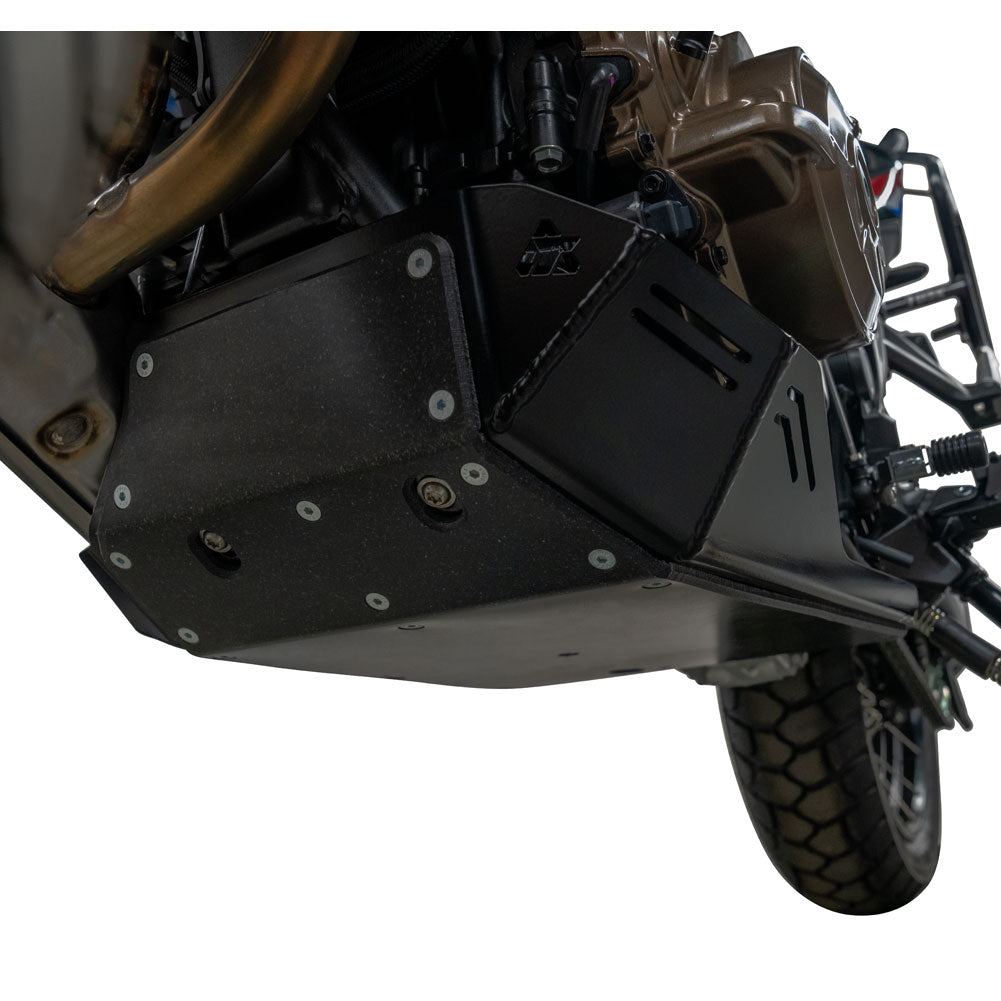 Black metal engine guard and skid plate with silver bolts, shown installed on a motorcycle against a white background.