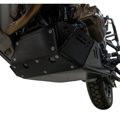Black metal engine guard and skid plate with silver bolts, shown installed on a motorcycle against a white background.