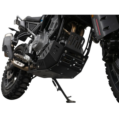 A black metal motorcycle engine guard and skid plate installed on a black off-road motorcycle, shown from a side-rear angle against a white background.